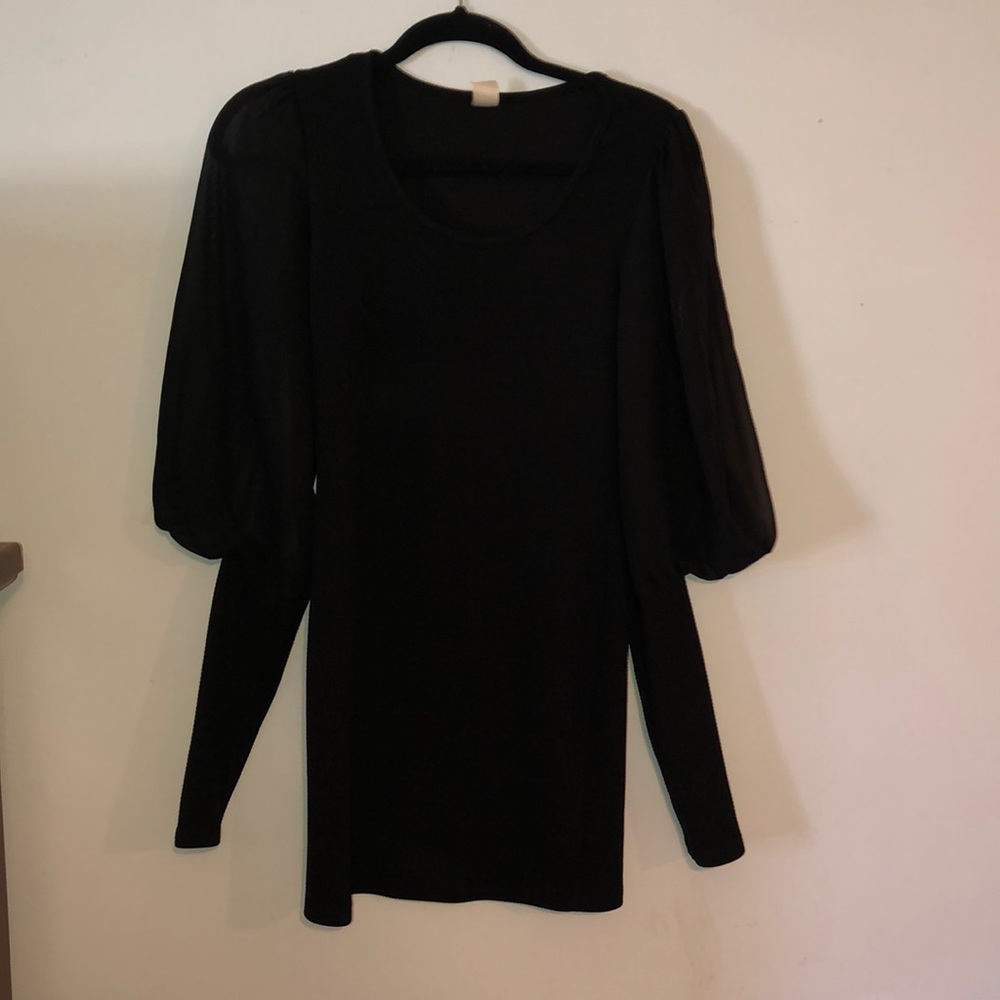 Little black dress fitted with sheer upper sleeves